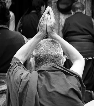 Divine Reverence: A Praying Monk in Tibet